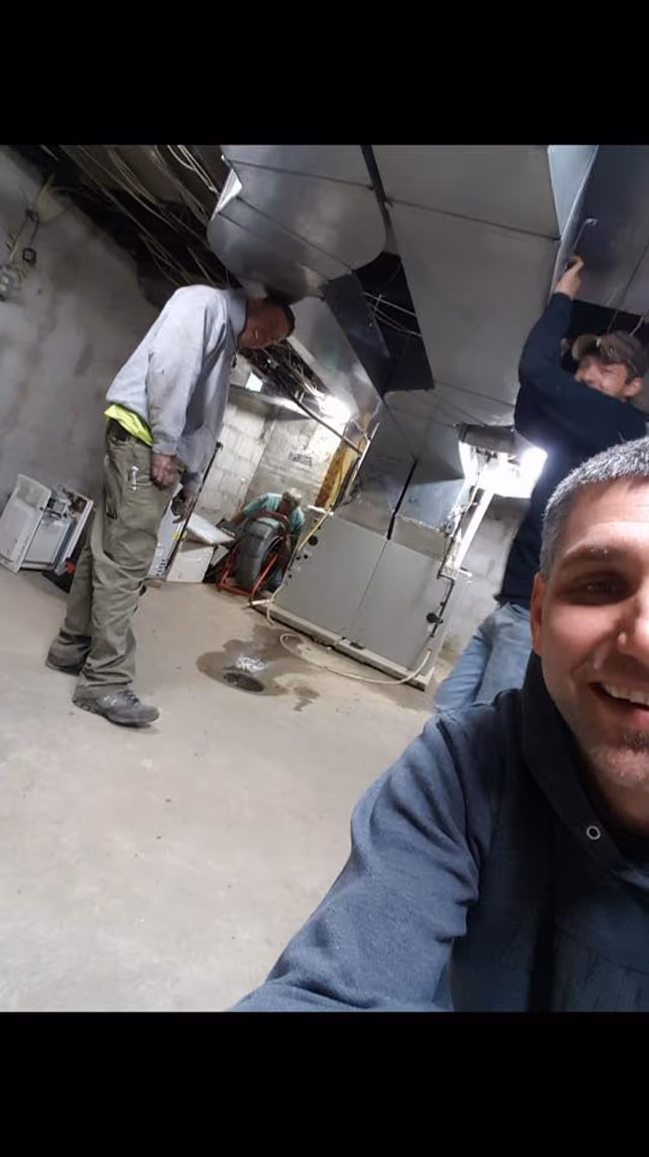 A MAS Plumbing technician on an emergency call in a mechanical room